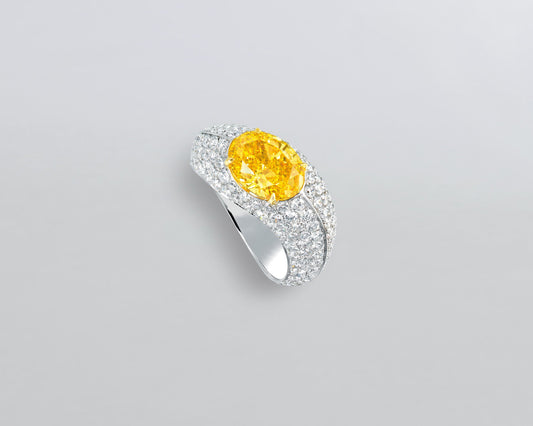 2.07 carat Oval Shape Fancy Vivid Orangy Yellow Diamond Ring